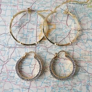 Two pairs of AKKAD gold toned hoop earrings